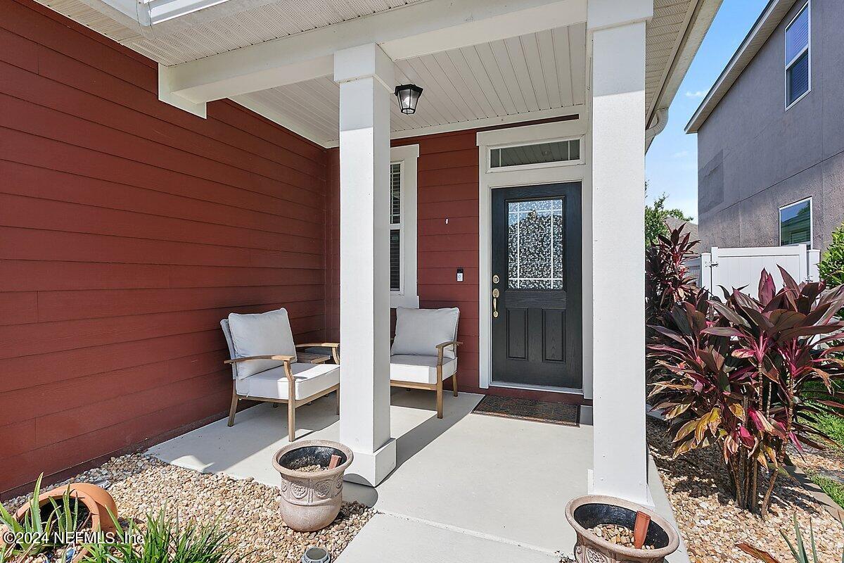 14720 Trellis Street Jacksonville, FL 32258 - Photo 2 of 21 a balcony with table and chairs