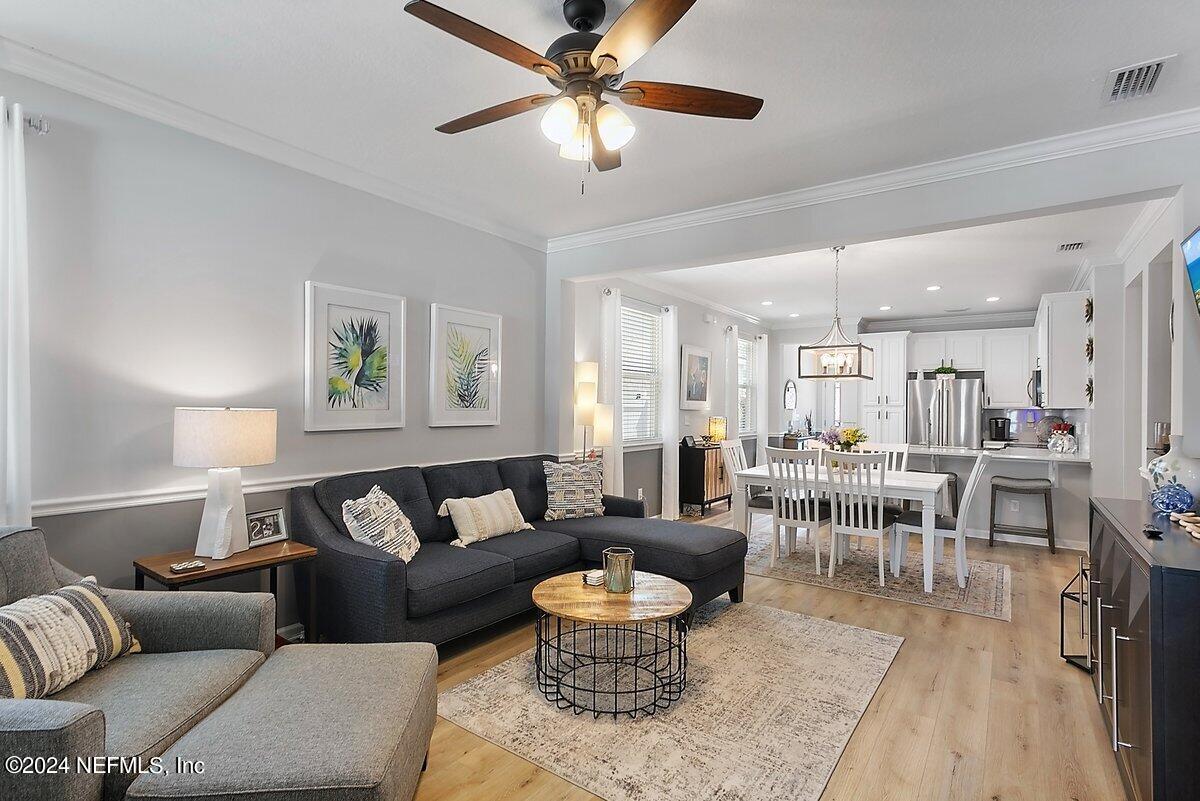 14720 Trellis Street Jacksonville, FL 32258 - Photo 10 of 21 a living room with furniture and a dining table