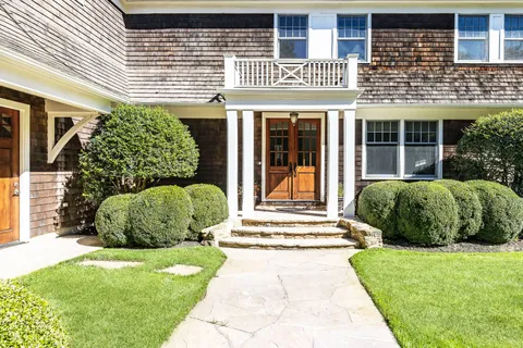 a front view of a house with a yard