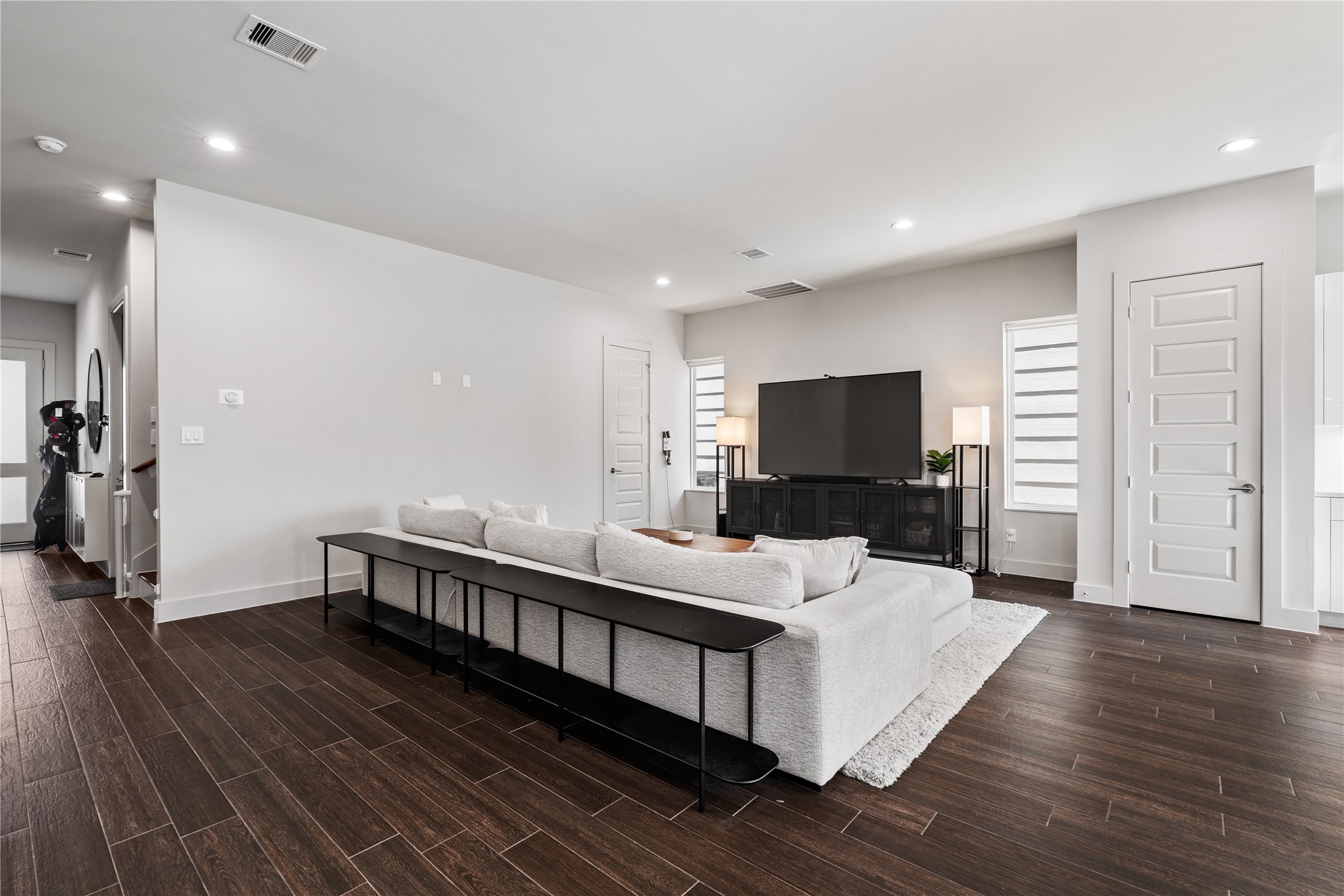 6813 Rocinante Lane Houston, TX 77092 - Photo 11 of 25 a living room with furniture and a flat screen tv