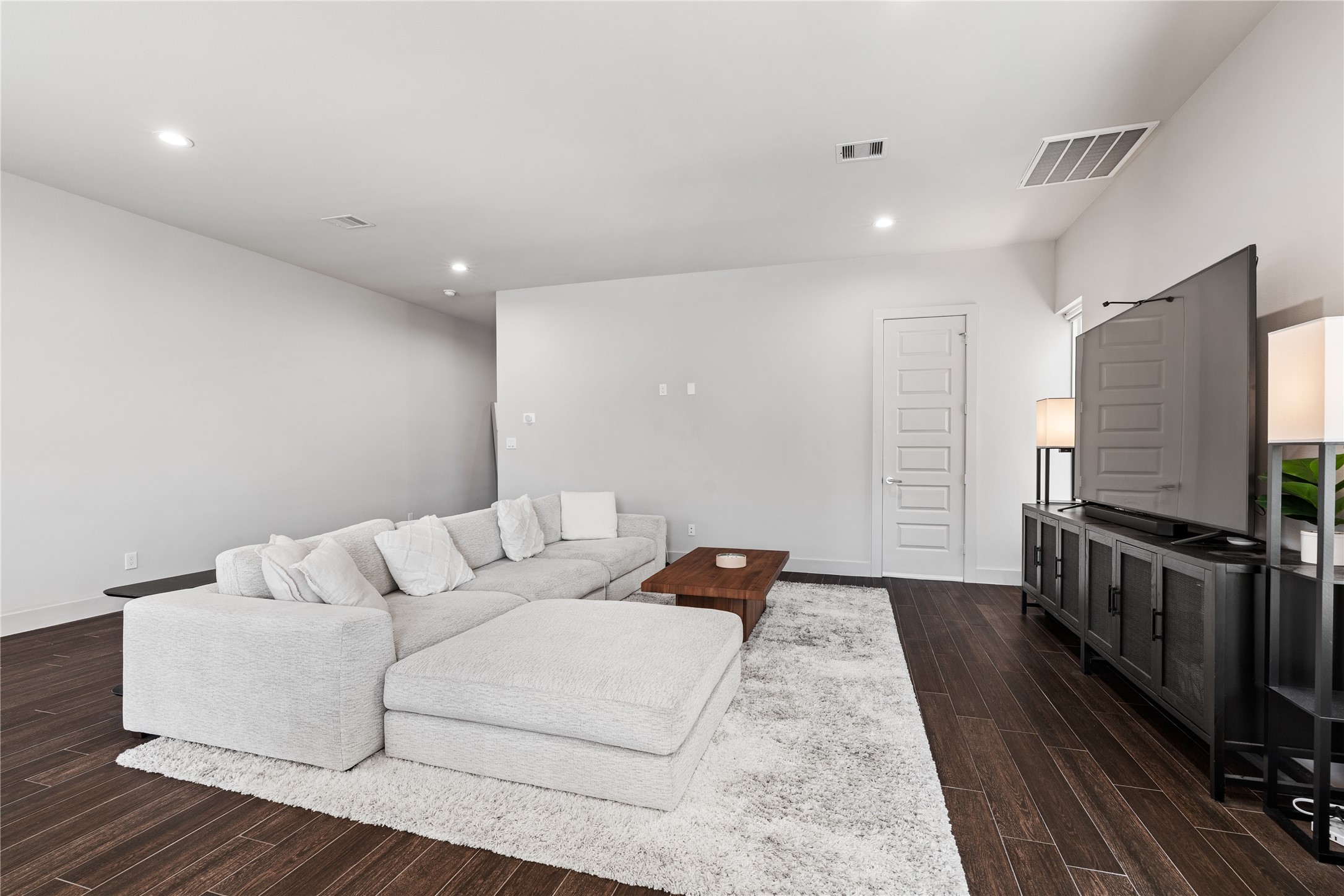 6813 Rocinante Lane Houston, TX 77092 - Photo 12 of 25 a living room with furniture and a flat screen tv
