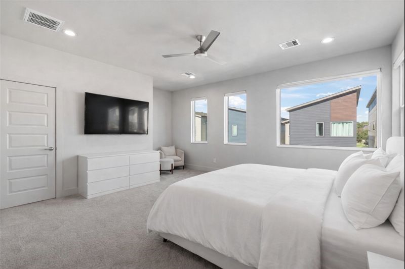 6813 Rocinante Lane Houston, TX 77092 - Photo 16 of 25 a bedroom with a bed and a flat screen tv
