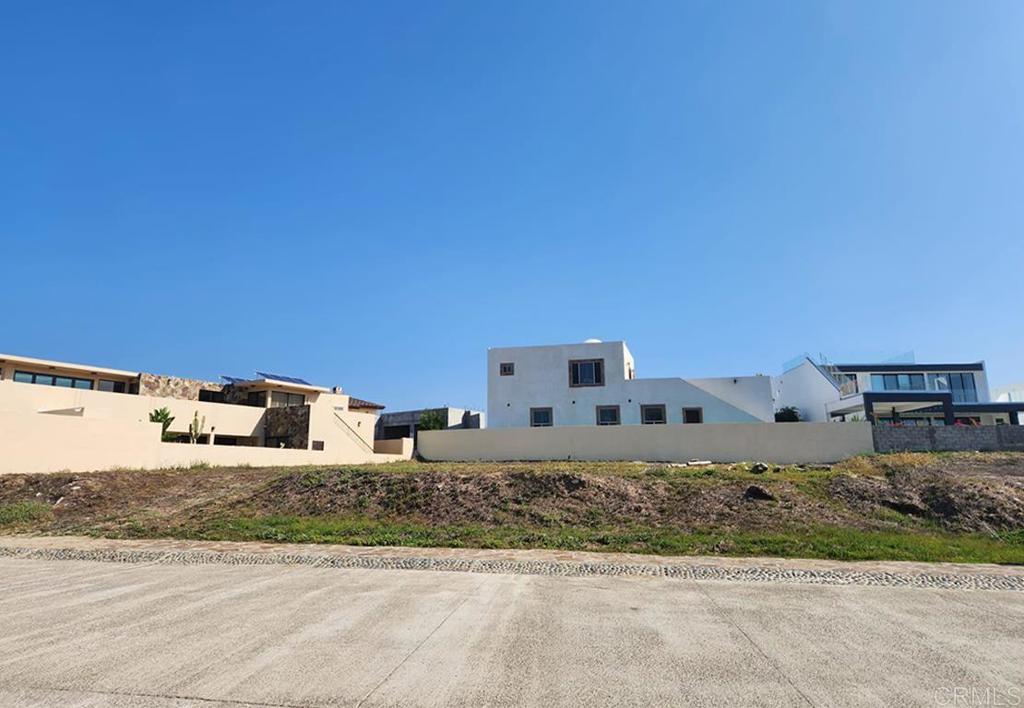 Punta Piedra Baja Mexico, CA 22765 - Photo 3 of 9 a front view of a house with a yard