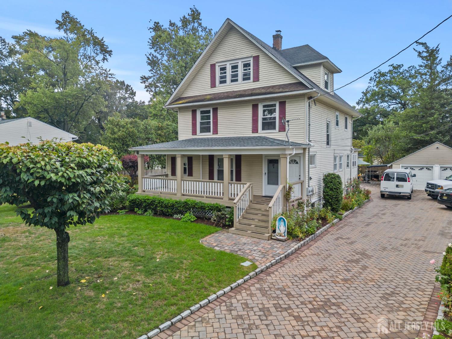 1237 South 10th Street South Plainfield, NJ 07080 - Photo 1 of 23 a front view of a house with garden