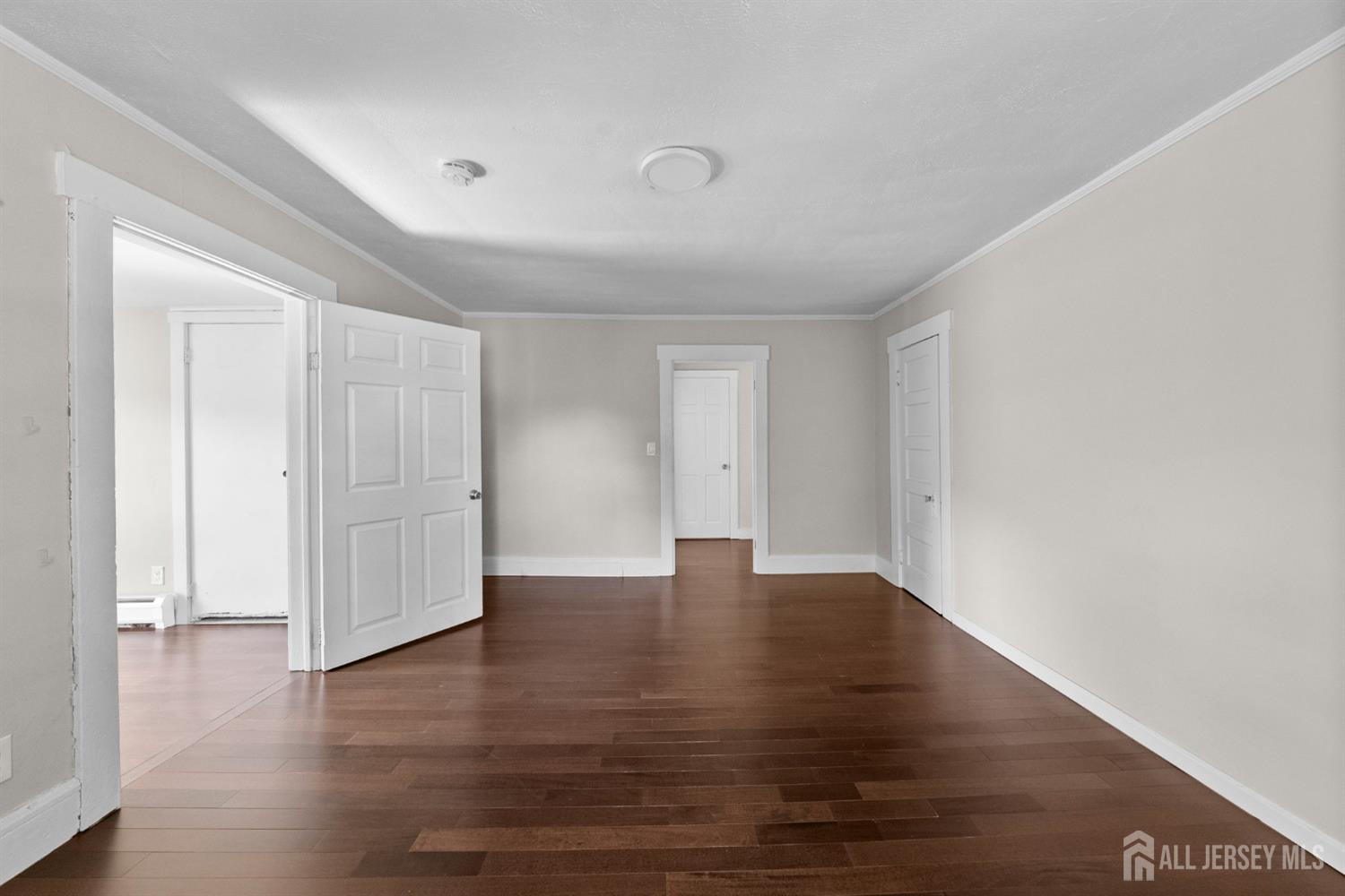 1237 South 10th Street South Plainfield, NJ 07080 - Photo 16 of 23 a view of an empty room with wooden floor