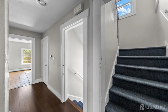 a view of entryway with wooden floor