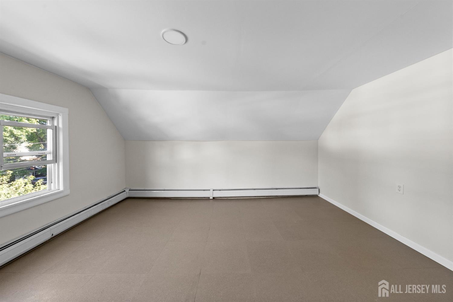 1237 South 10th Street South Plainfield, NJ 07080 - Photo 18 of 23 a view of an empty room with a window