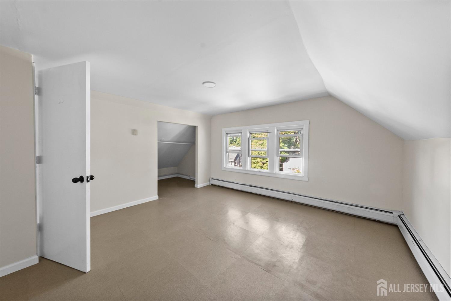 1237 South 10th Street South Plainfield, NJ 07080 - Photo 19 of 23 an empty room with windows and closet