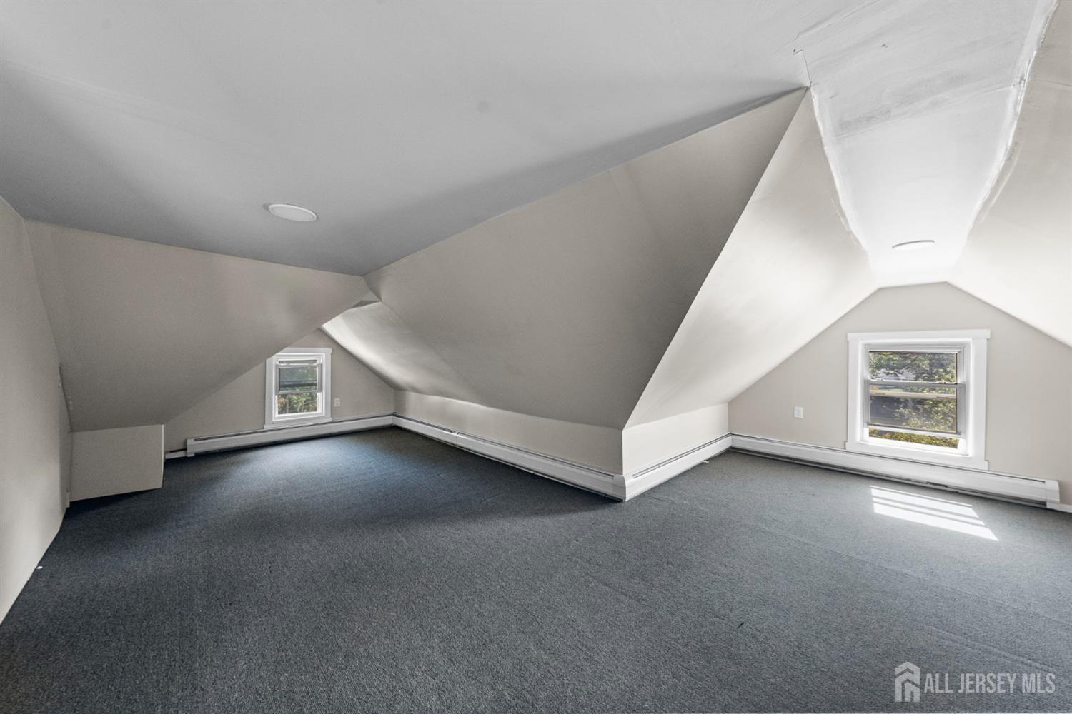 1237 South 10th Street South Plainfield, NJ 07080 - Photo 21 of 23 a view of an empty room with a window