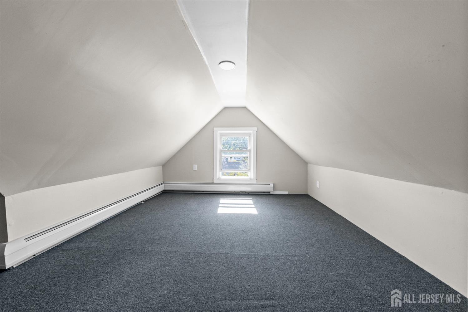 1237 South 10th Street South Plainfield, NJ 07080 - Photo 23 of 23 a view of an empty room with a window