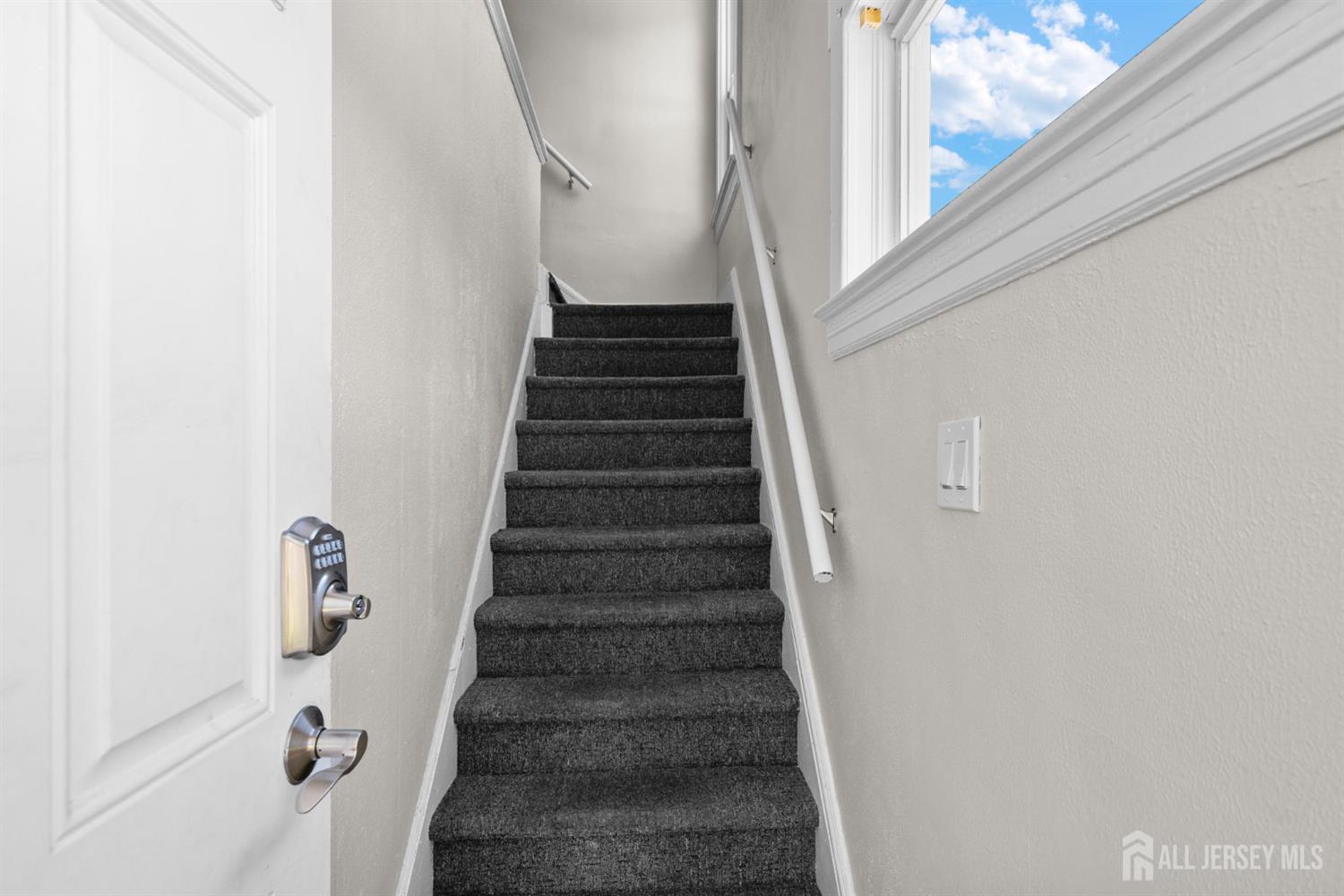 1237 South 10th Street South Plainfield, NJ 07080 - Photo 5 of 23 a view of staircase with wooden floor and white walls