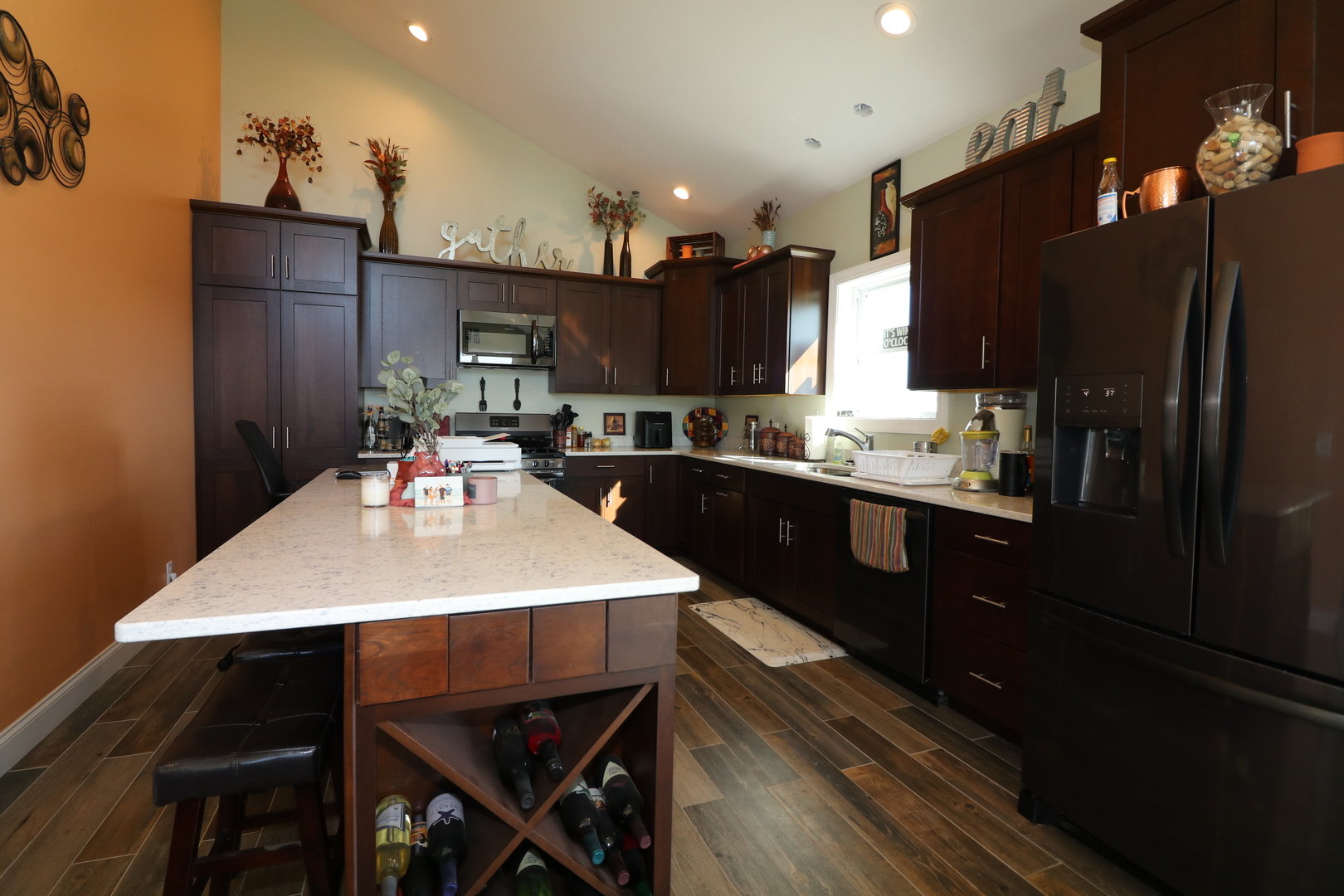 10865 Lake Road Dewitt, IL 61735 - Photo 7 of 35 a kitchen with kitchen island a sink stove and refrigerator