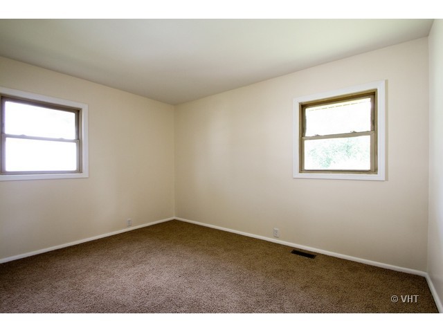 627 West Romeo Road Romeoville, IL 60446 - Photo 6 of 10 an empty room with a window