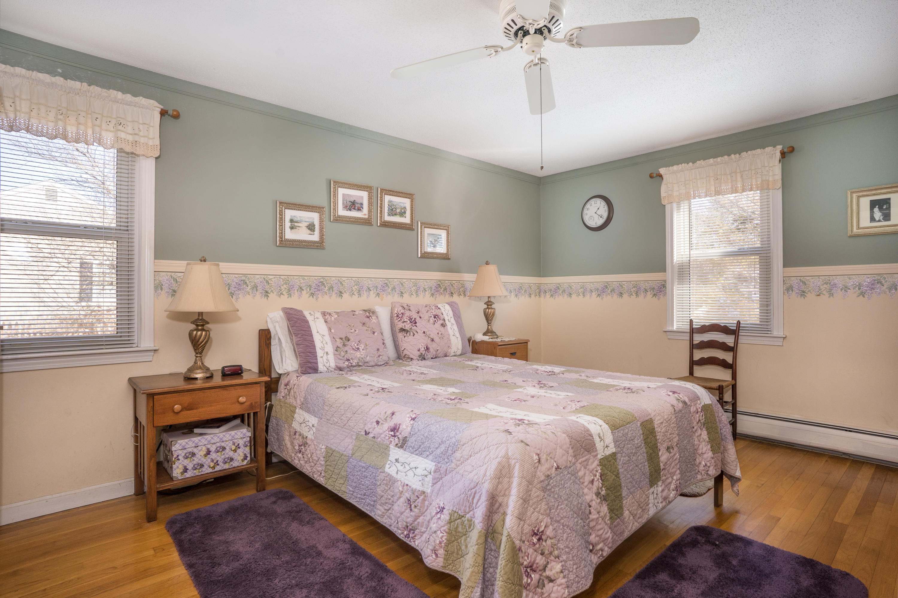8 Black Valley Road Centerville, MA 02632 - Photo 12 of 15 a bedroom with a bed and a chandelier