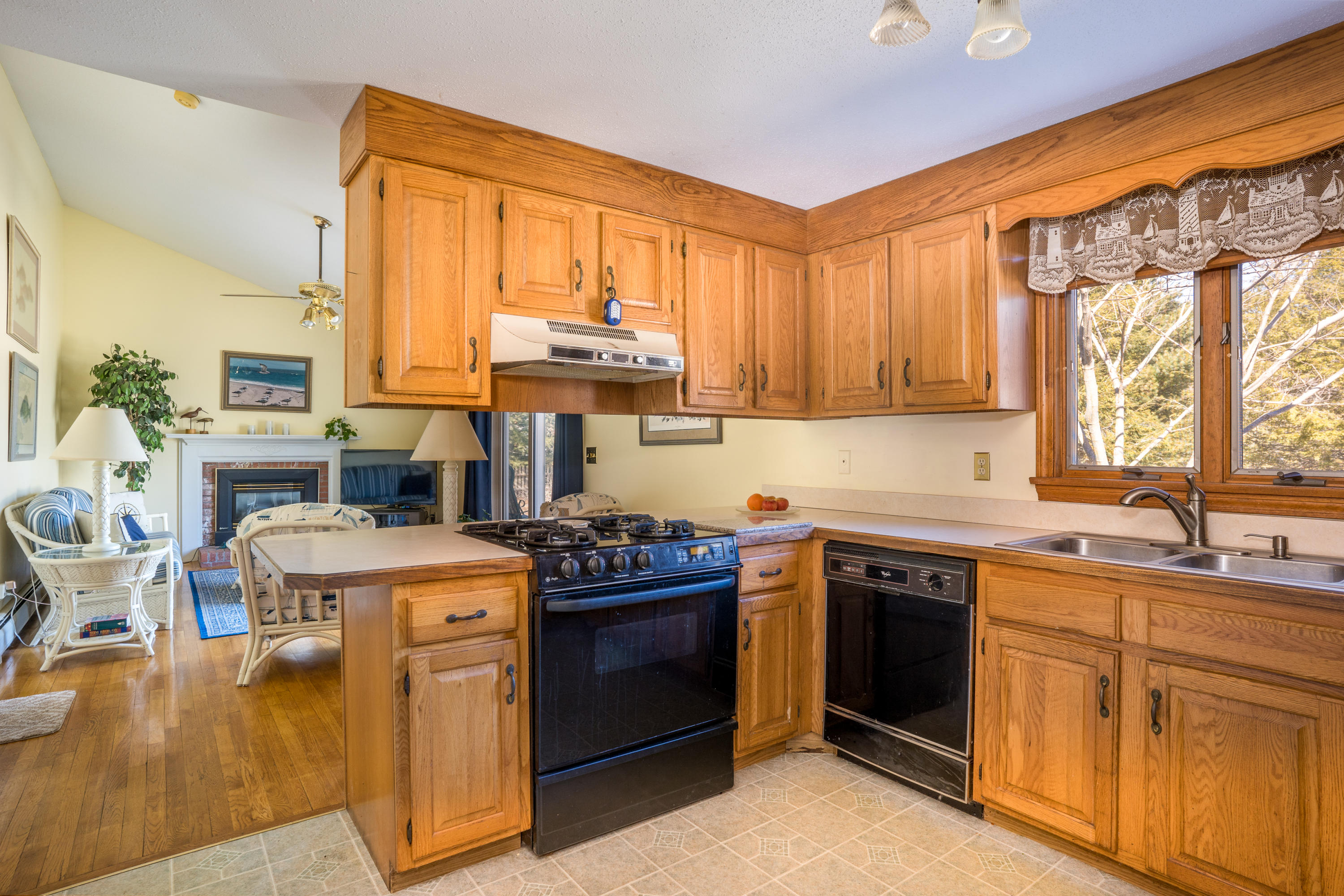 8 Black Valley Road Centerville, MA 02632 - Photo 8 of 15 a kitchen with a stove top oven sink and cabinets