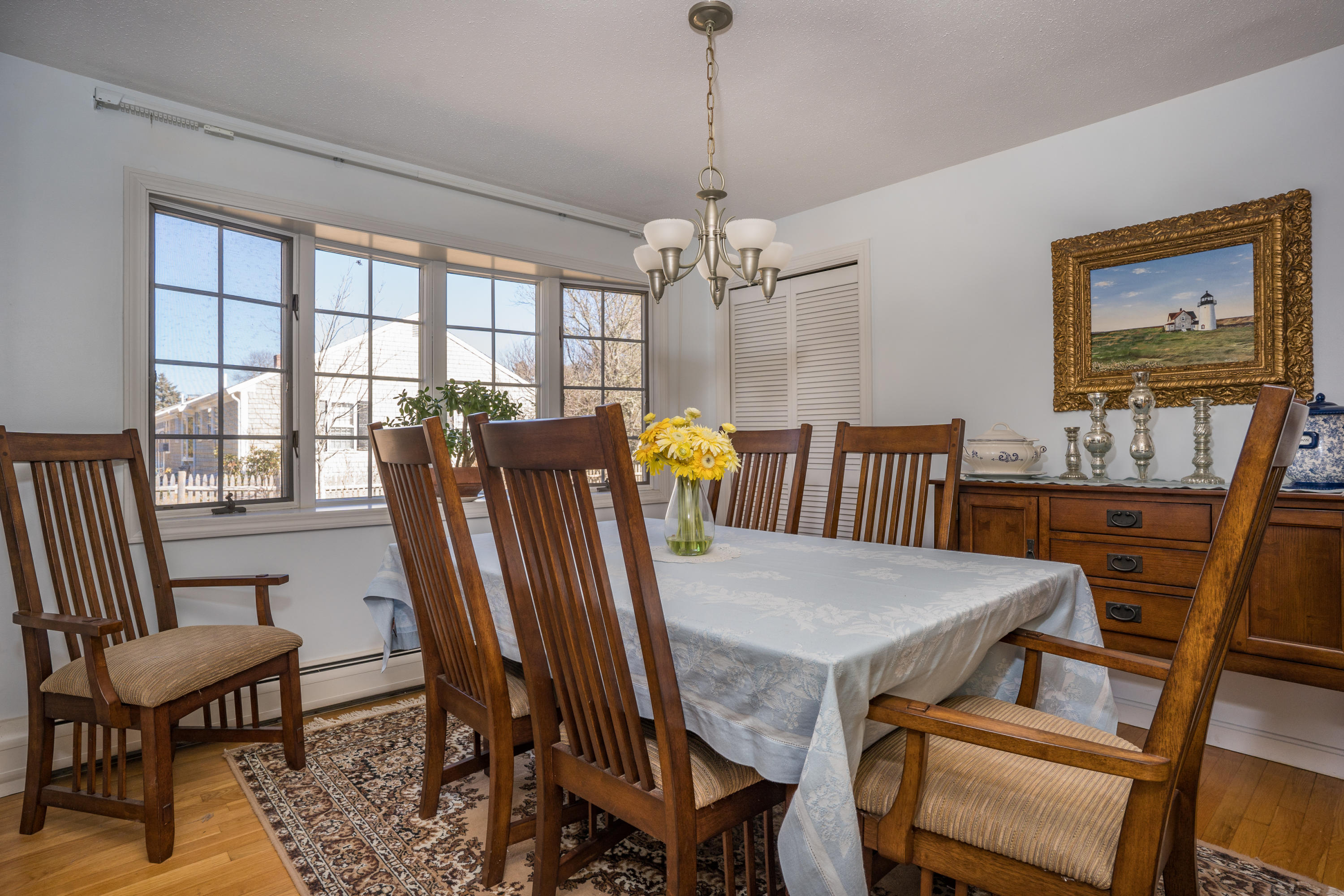8 Black Valley Road Centerville, MA 02632 - Photo 10 of 15 a view of a dining room with furniture window and wooden floor