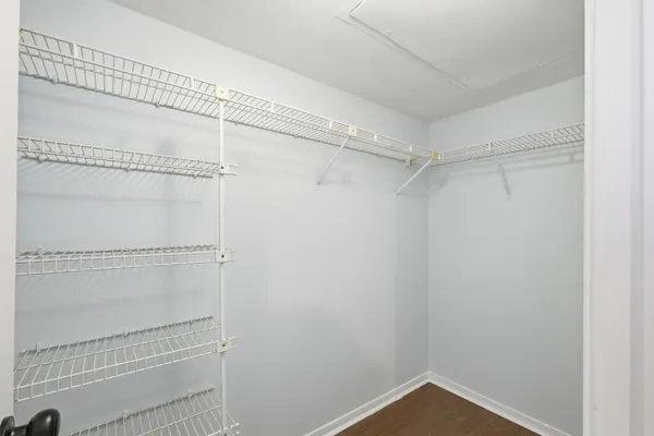 a view of an empty walk in closet