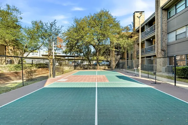 a view of a building with a backyard