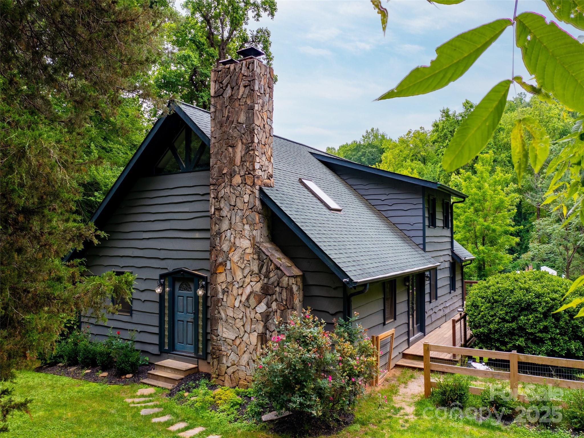 373 Vineyard Road Tryon, NC 28782 - Photo 1 of 46 a house view with a garden