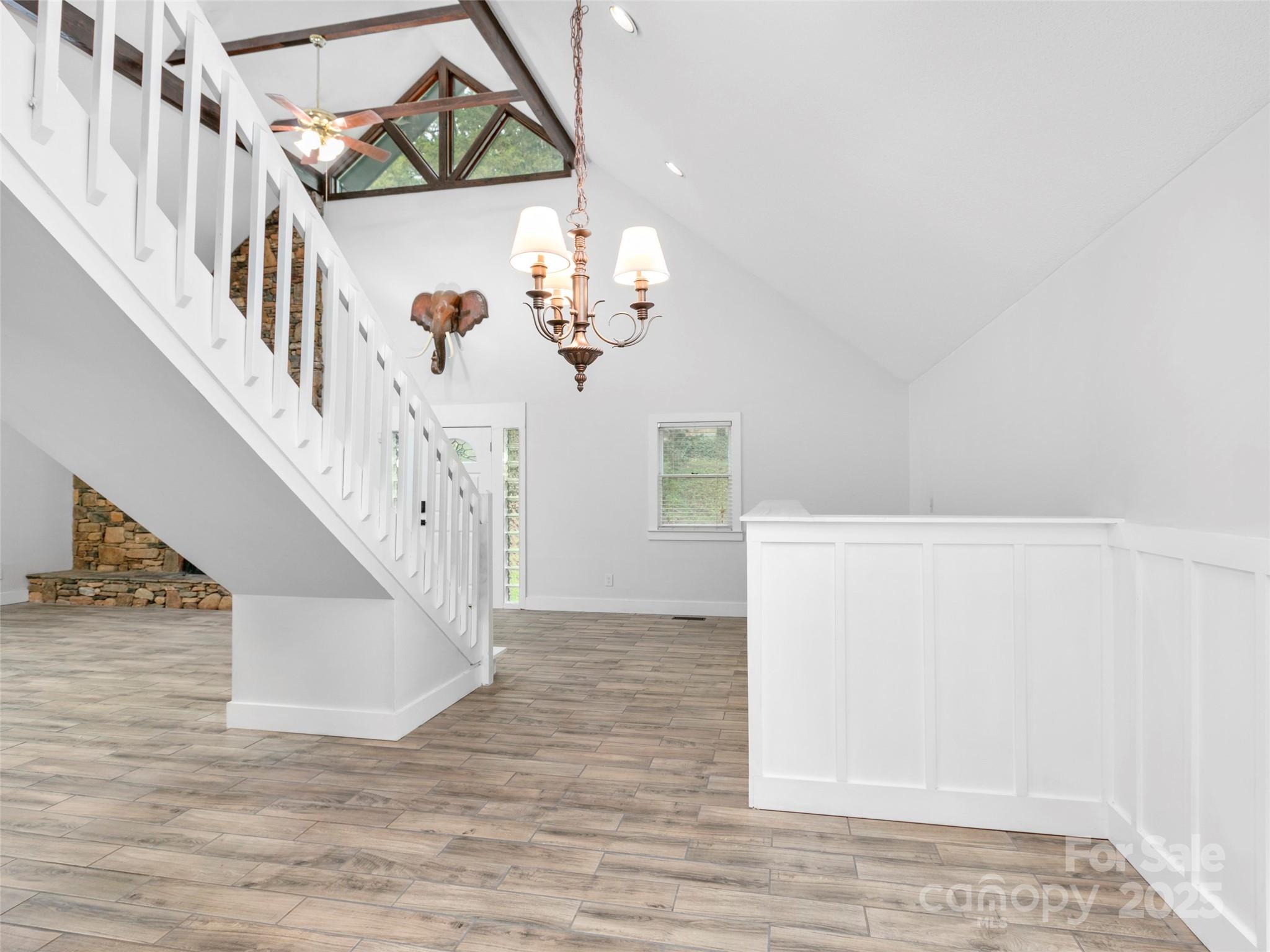 373 Vineyard Road Tryon, NC 28782 - Photo 12 of 46 a view of entryway and hall with wooden floor