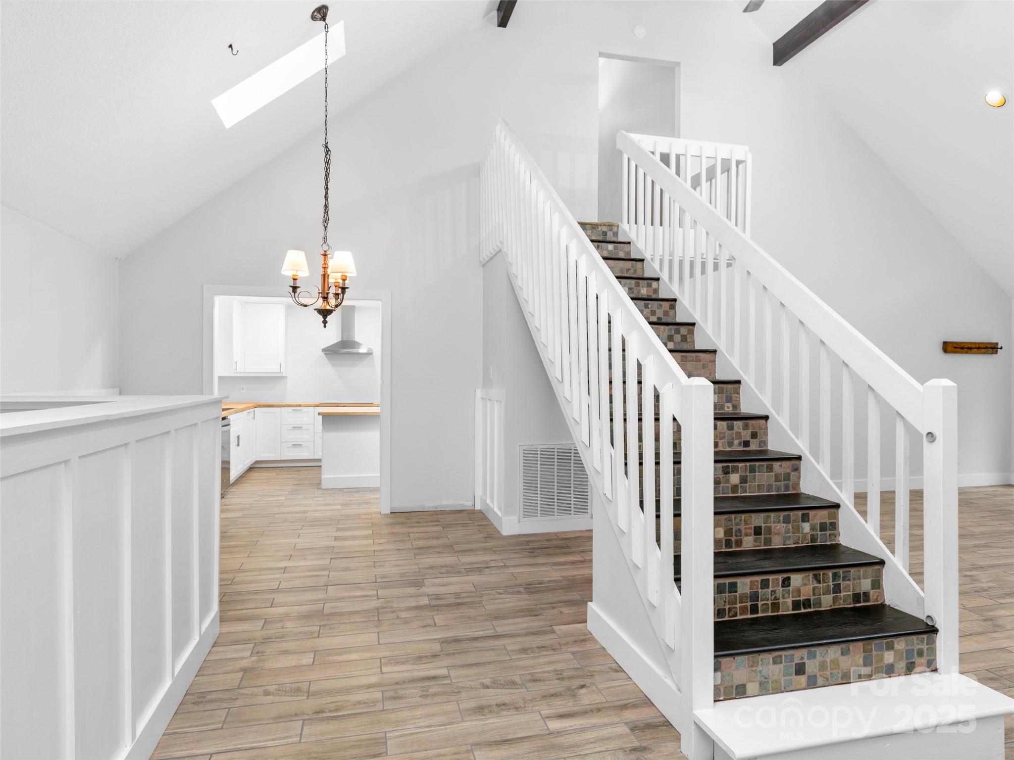 373 Vineyard Road Tryon, NC 28782 - Photo 13 of 46 a view of entryway and hall with wooden floor