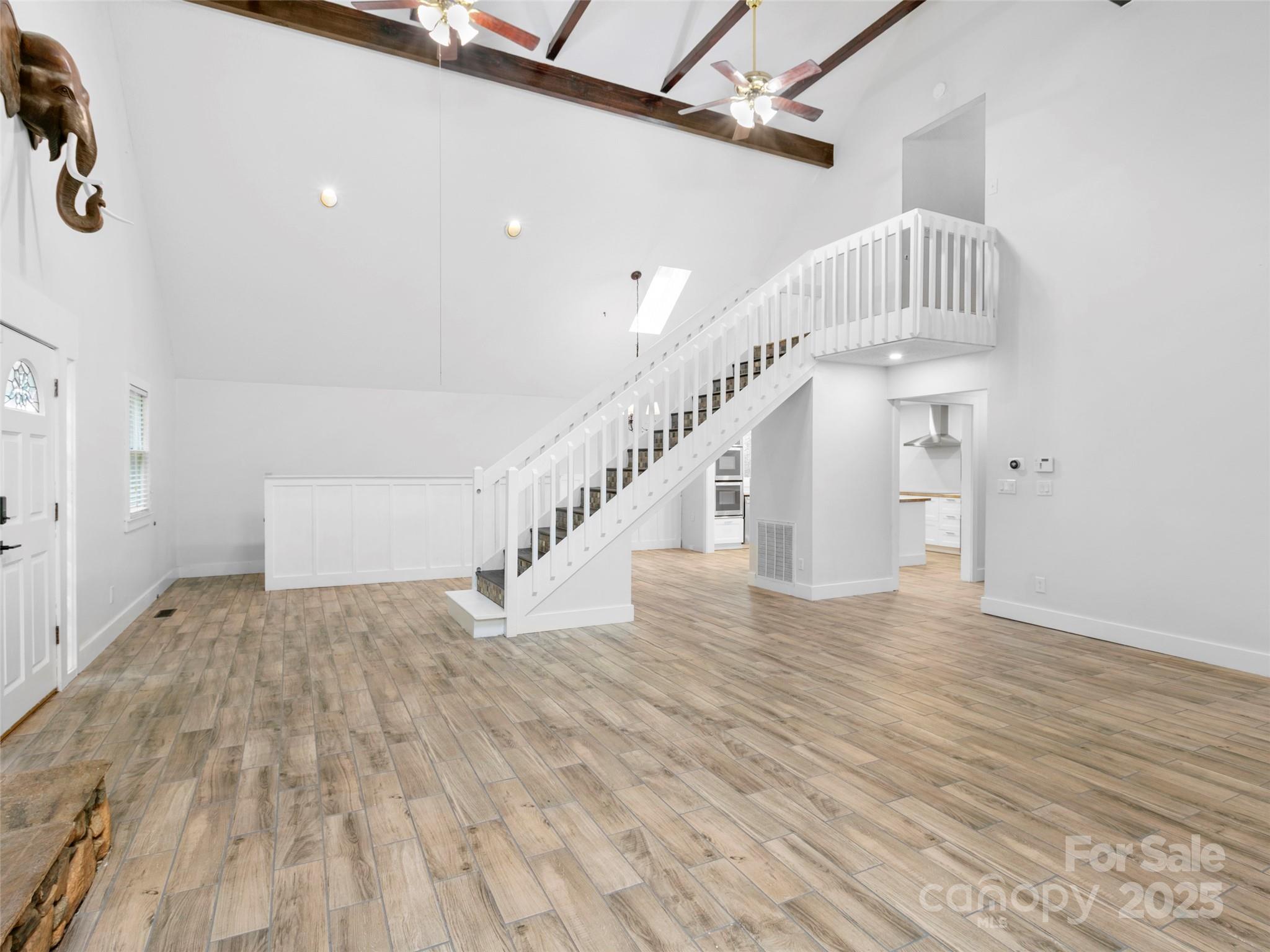 373 Vineyard Road Tryon, NC 28782 - Photo 16 of 46 a view of entryway and hall with wooden floor