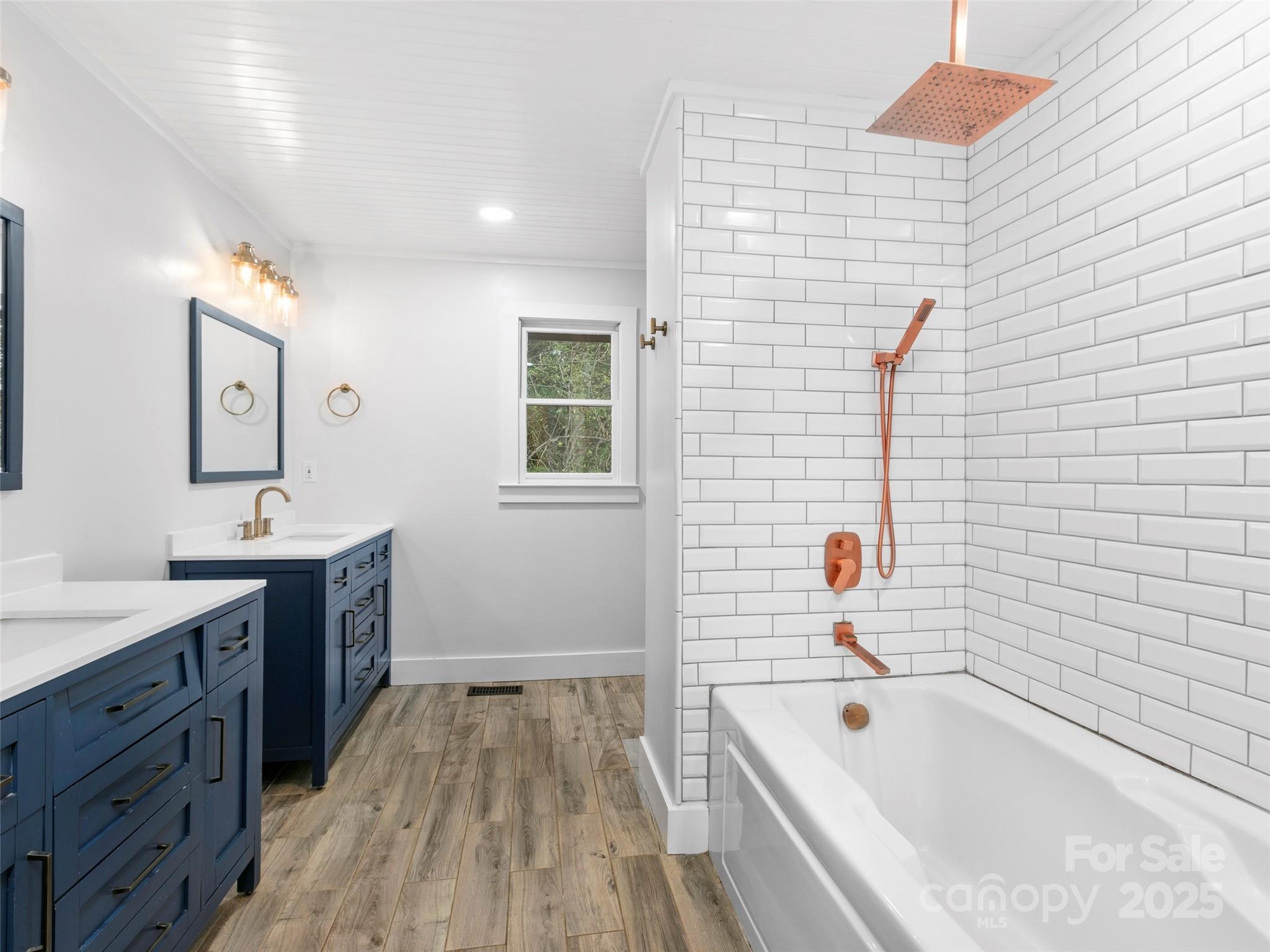 373 Vineyard Road Tryon, NC 28782 - Photo 17 of 46 a bathroom with a tub sink and mirror
