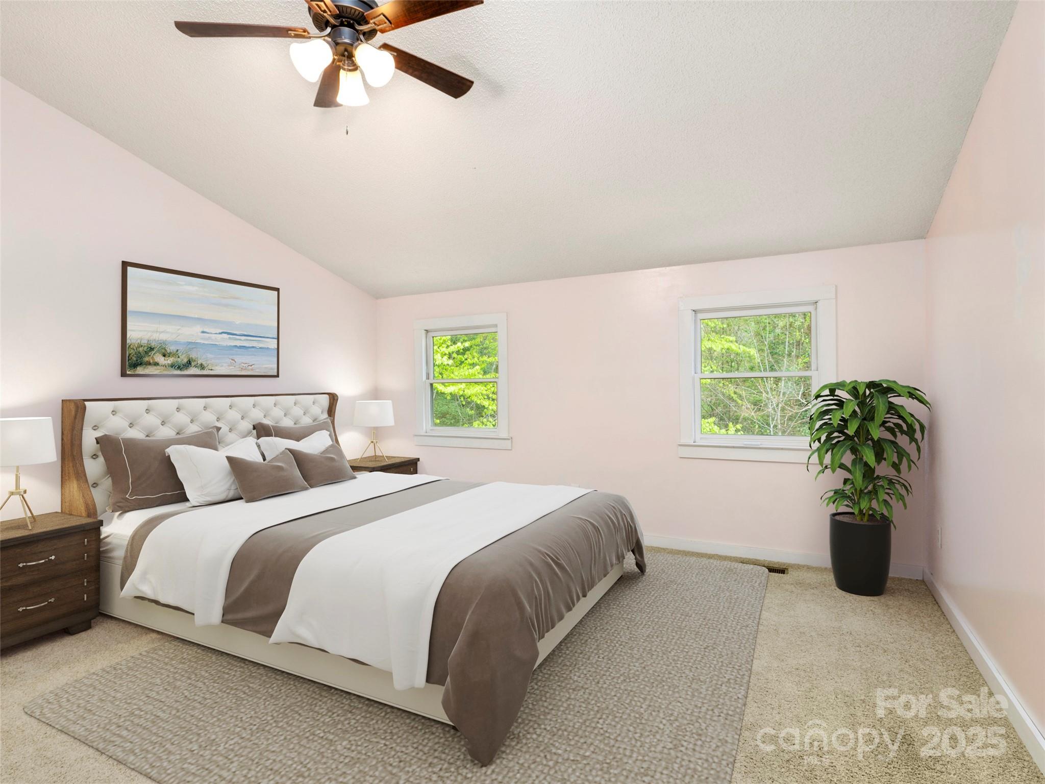 373 Vineyard Road Tryon, NC 28782 - Photo 22 of 46 a bedroom with a bed and a potted plant