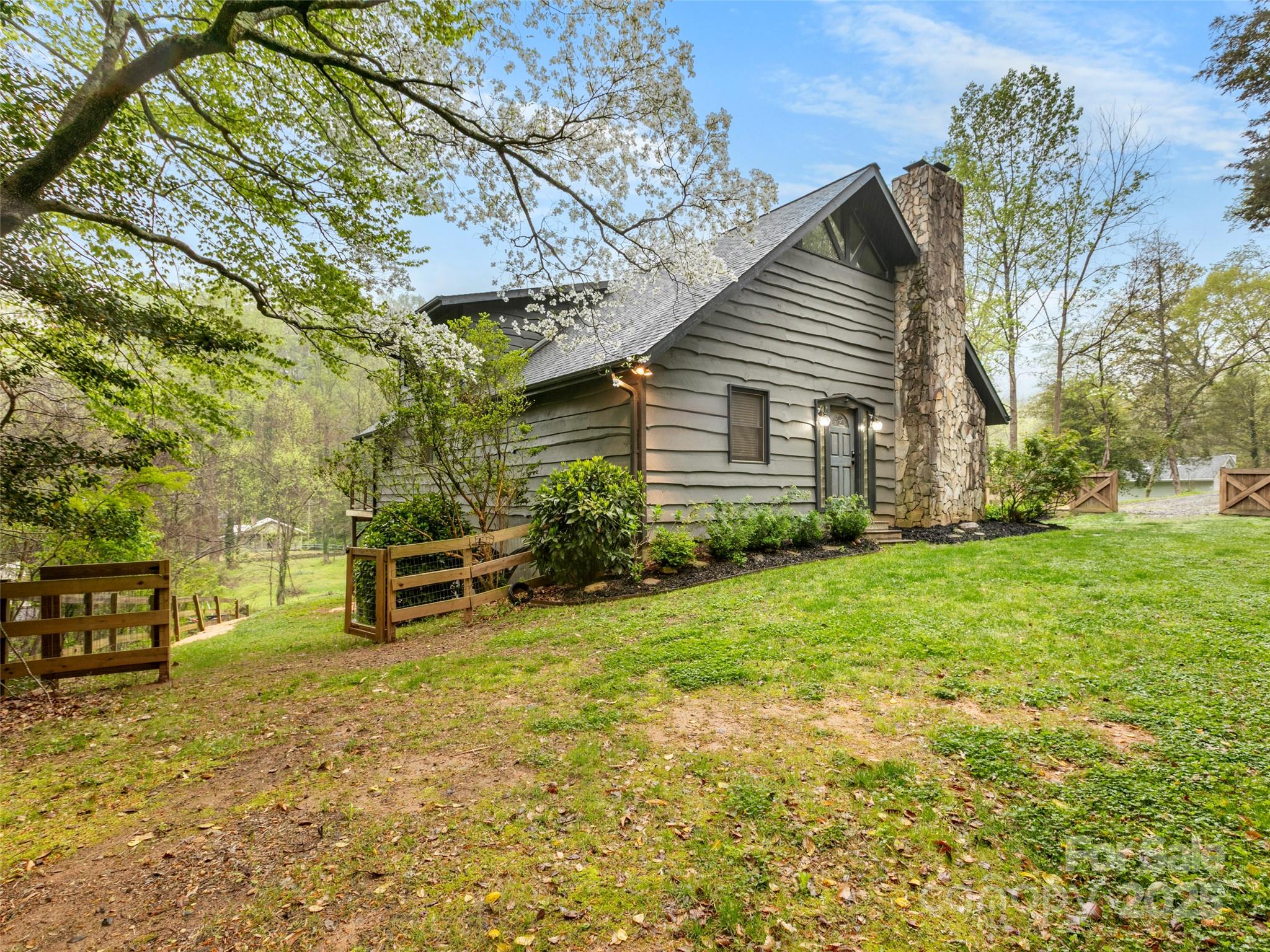 373 Vineyard Road Tryon, NC 28782 - Photo 31 of 46 a view of a house with backyard and sitting area