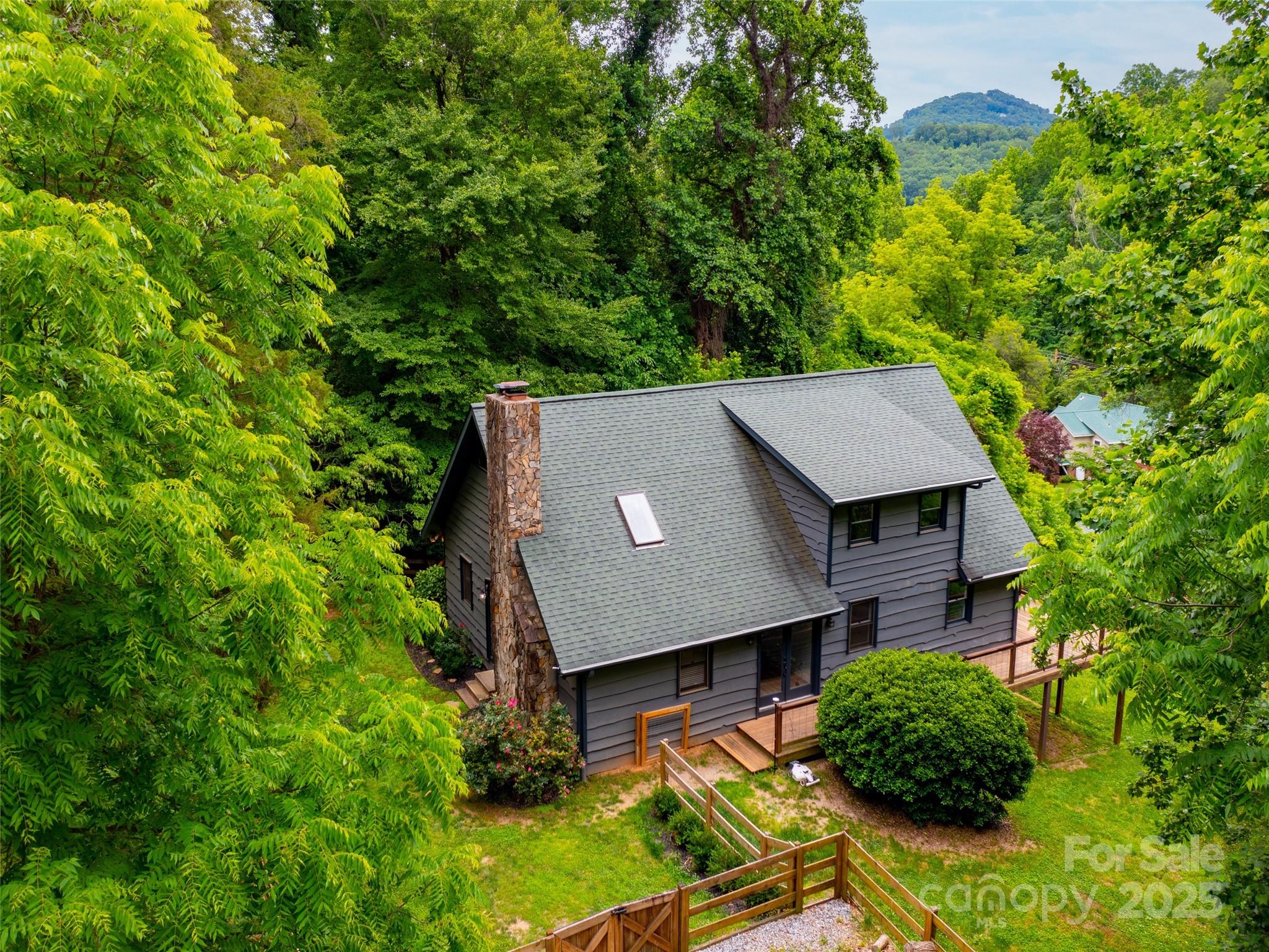 373 Vineyard Road Tryon, NC 28782 - Photo 45 of 46 an aerial view of a house with yard and outdoor seating