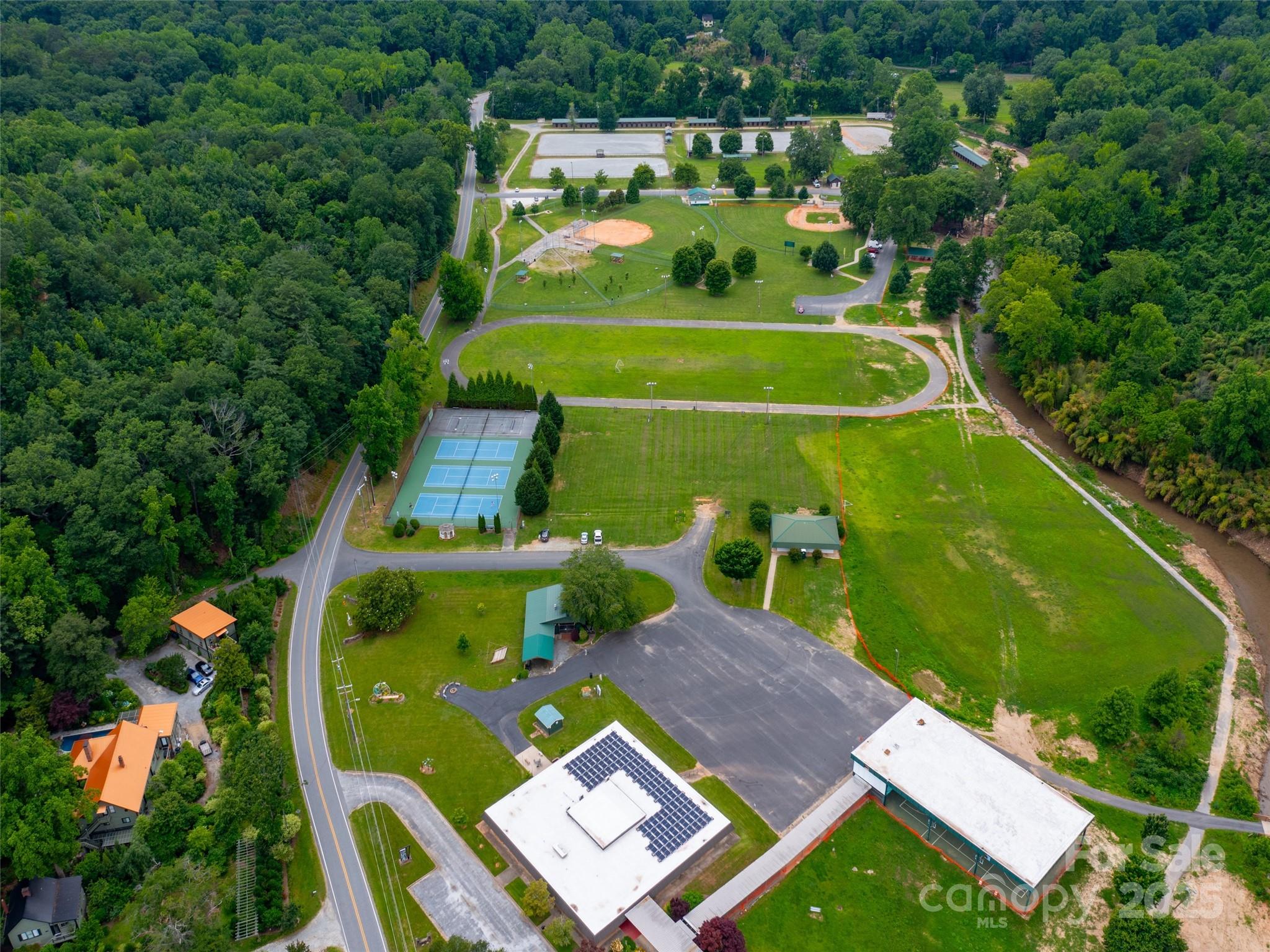 373 Vineyard Road Tryon, NC 28782 - Photo 46 of 46 an aerial view of a pool yard patio and outdoor seating