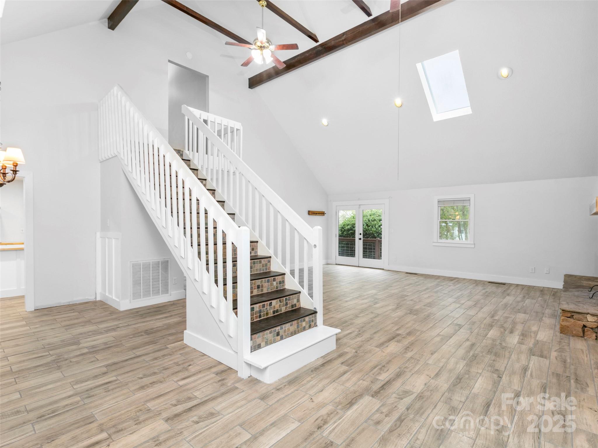 373 Vineyard Road Tryon, NC 28782 - Photo 6 of 46 a view of entryway and hall with wooden floor