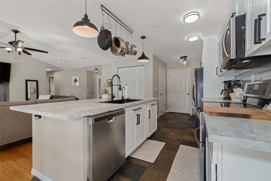 158 Oak Ridge Circle Oak Creek, CO 80467 - Photo 14 of 47 a kitchen with stainless steel appliances granite countertop a sink and stove