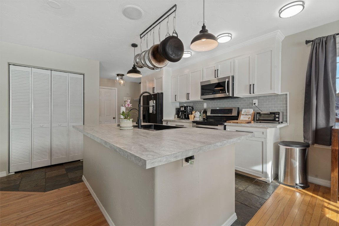 158 Oak Ridge Circle Oak Creek, CO 80467 - Photo 16 of 47 a kitchen with stainless steel appliances a refrigerator a stove a microwave and cabinets