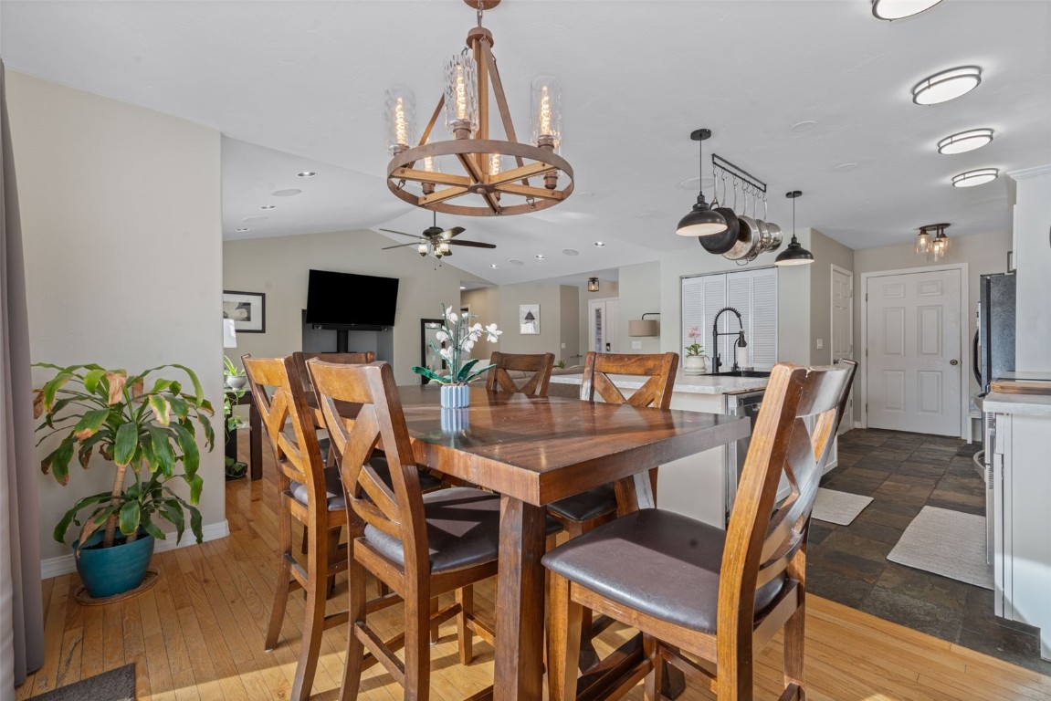 158 Oak Ridge Circle Oak Creek, CO 80467 - Photo 19 of 47 a view of a dining room with furniture wooden floor and chandelier
