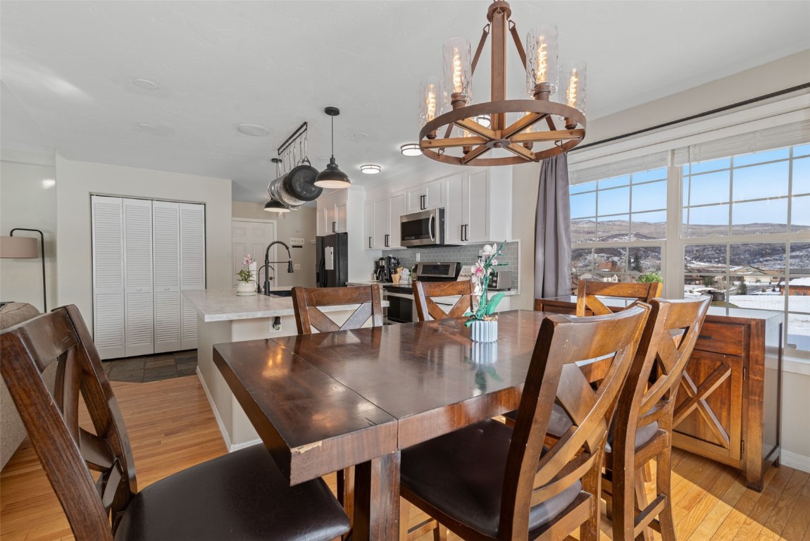 158 Oak Ridge Circle Oak Creek, CO 80467 - Photo 20 of 47 a view of a dining room with furniture window and outside view
