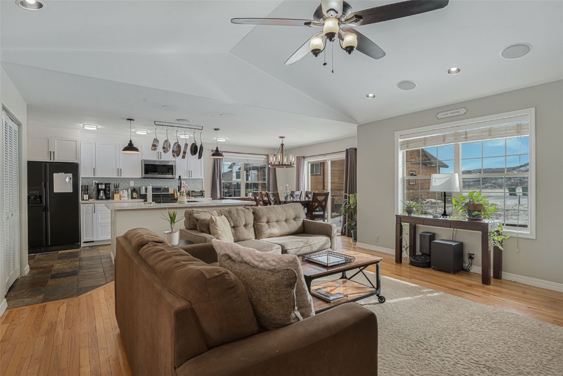 158 Oak Ridge Circle Oak Creek, CO 80467 - Photo 2 of 47 a living room with furniture kitchen view and a chandelier