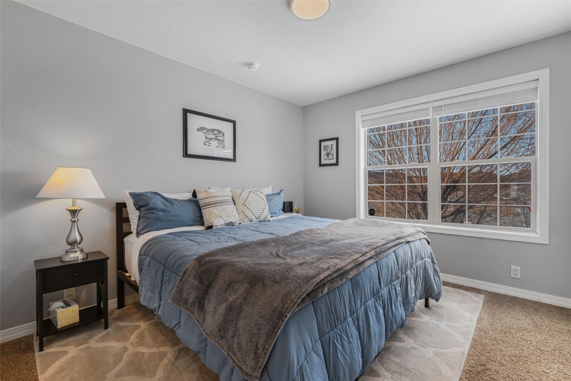 158 Oak Ridge Circle Oak Creek, CO 80467 - Photo 27 of 47 a bedroom with a bed and a window