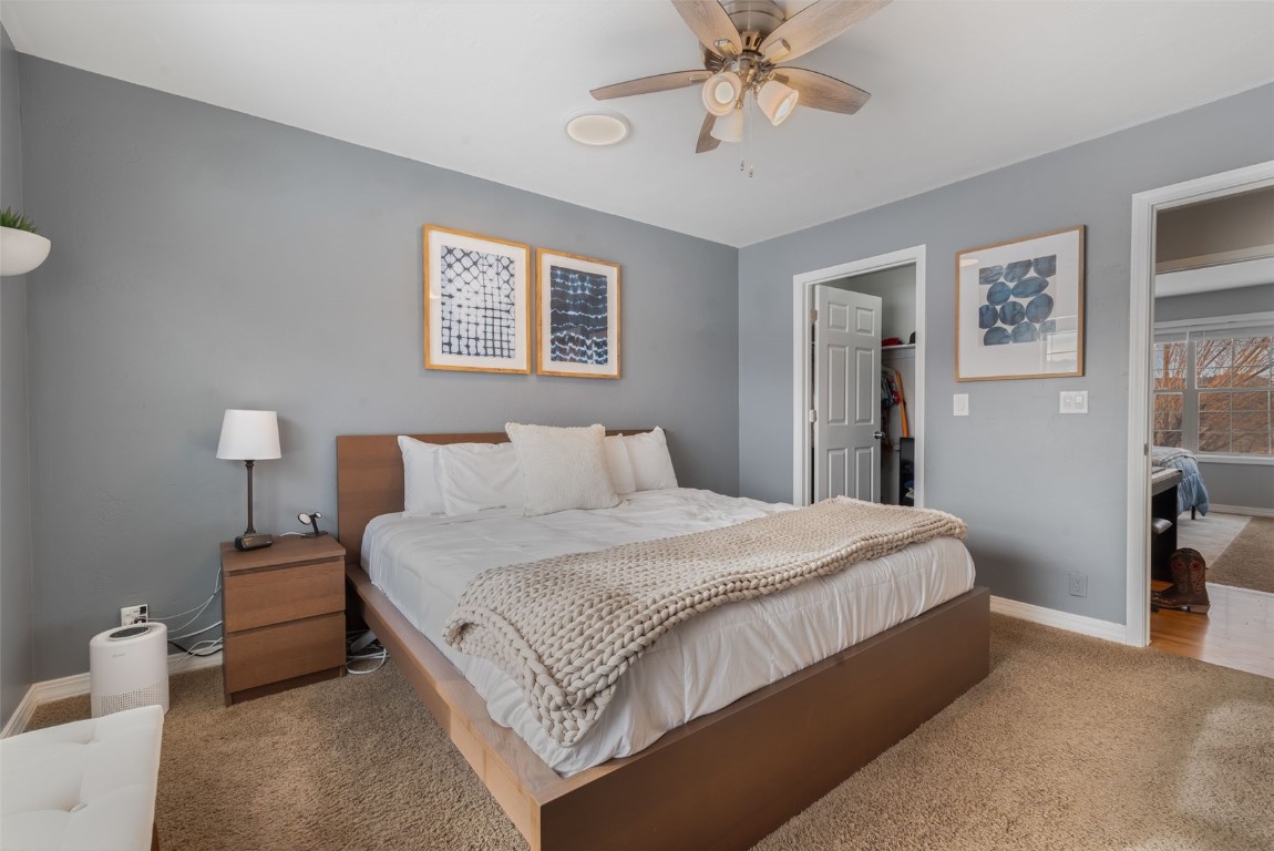 158 Oak Ridge Circle Oak Creek, CO 80467 - Photo 29 of 47 a bedroom with a bed and a chandelier