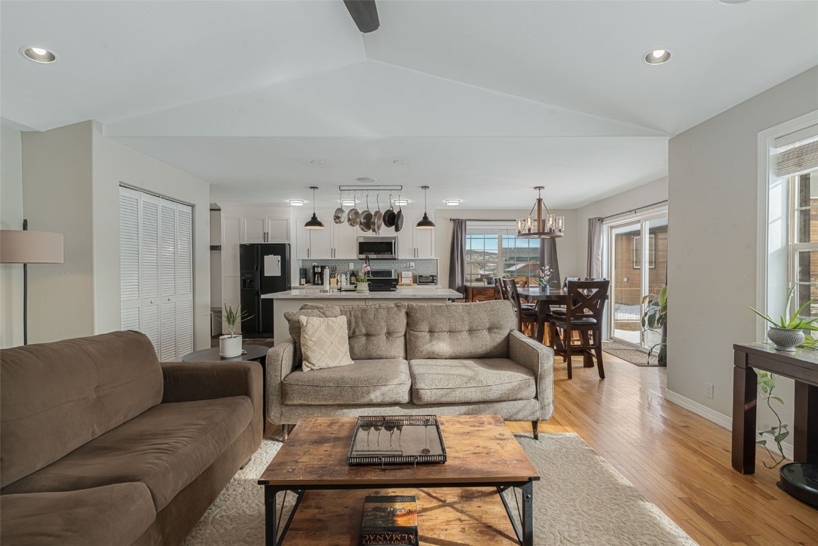 158 Oak Ridge Circle Oak Creek, CO 80467 - Photo 3 of 47 a living room with furniture and a dining table with kitchen view