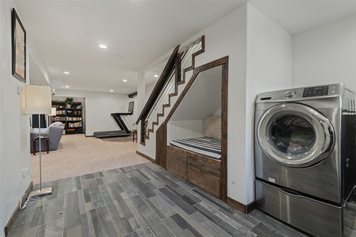 158 Oak Ridge Circle Oak Creek, CO 80467 - Photo 37 of 47 a view of a livingroom with furniture wooden floor staircase and a kitchen