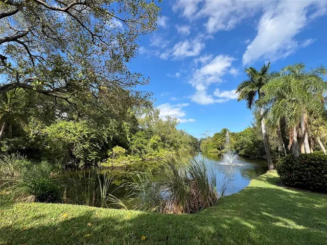 a sign that is sitting in front of flowers