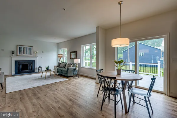 a view of a livingroom with furniture window and wooden floor