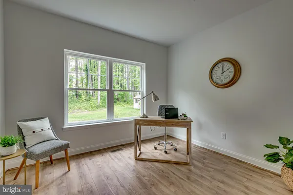 a view of table with window and wooden floor