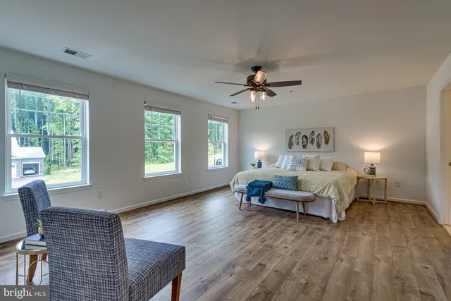 a living room with furniture and windows