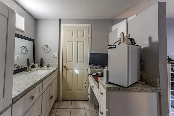 a bedroom with furniture and a couch