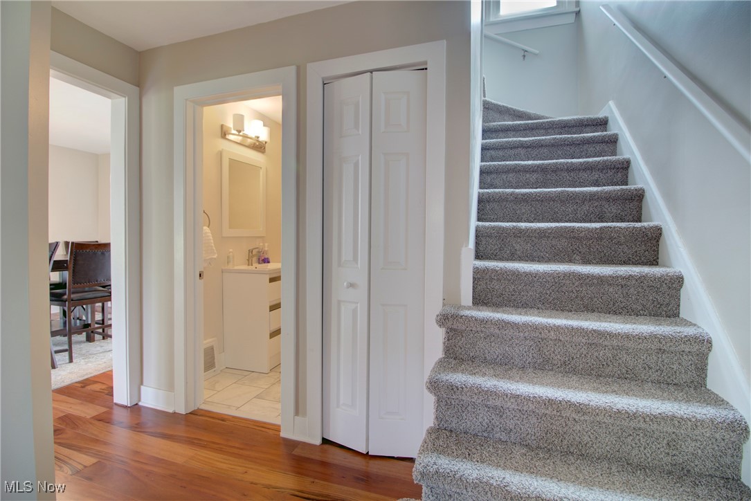 311 Hillside Road Independence, OH 44131 - Photo 26 of 46 Stairway featuring hardwood / wood-style floors