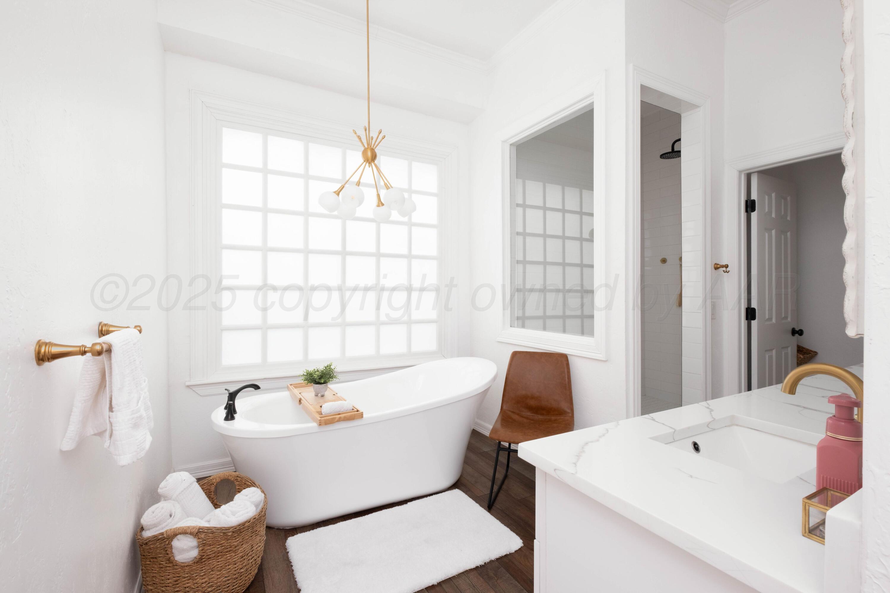 3207 Parker Street Amarillo, TX 79109 - Photo 32 of 73 a white bath tub sitting next to a white sink