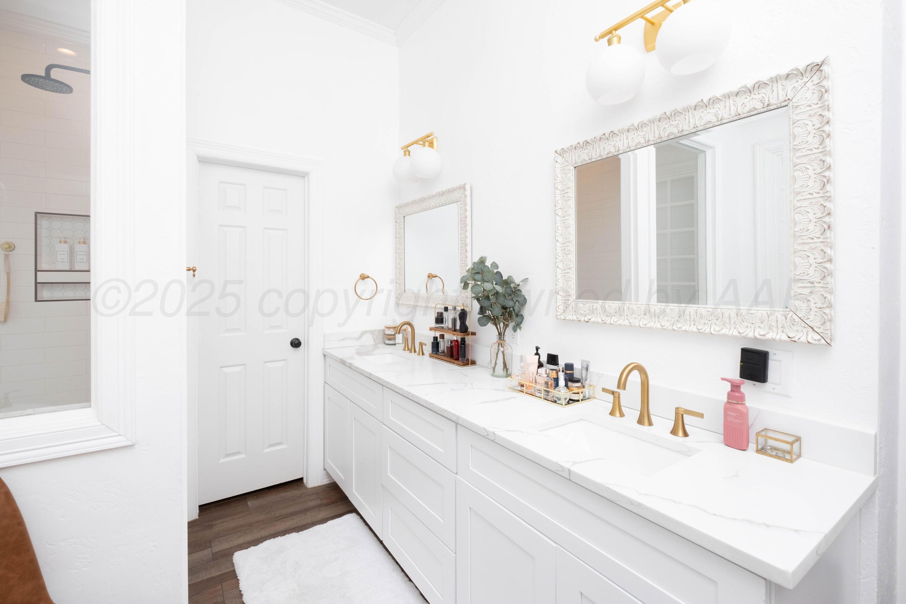 3207 Parker Street Amarillo, TX 79109 - Photo 34 of 73 a bathroom with a sink a vanity and a mirror
