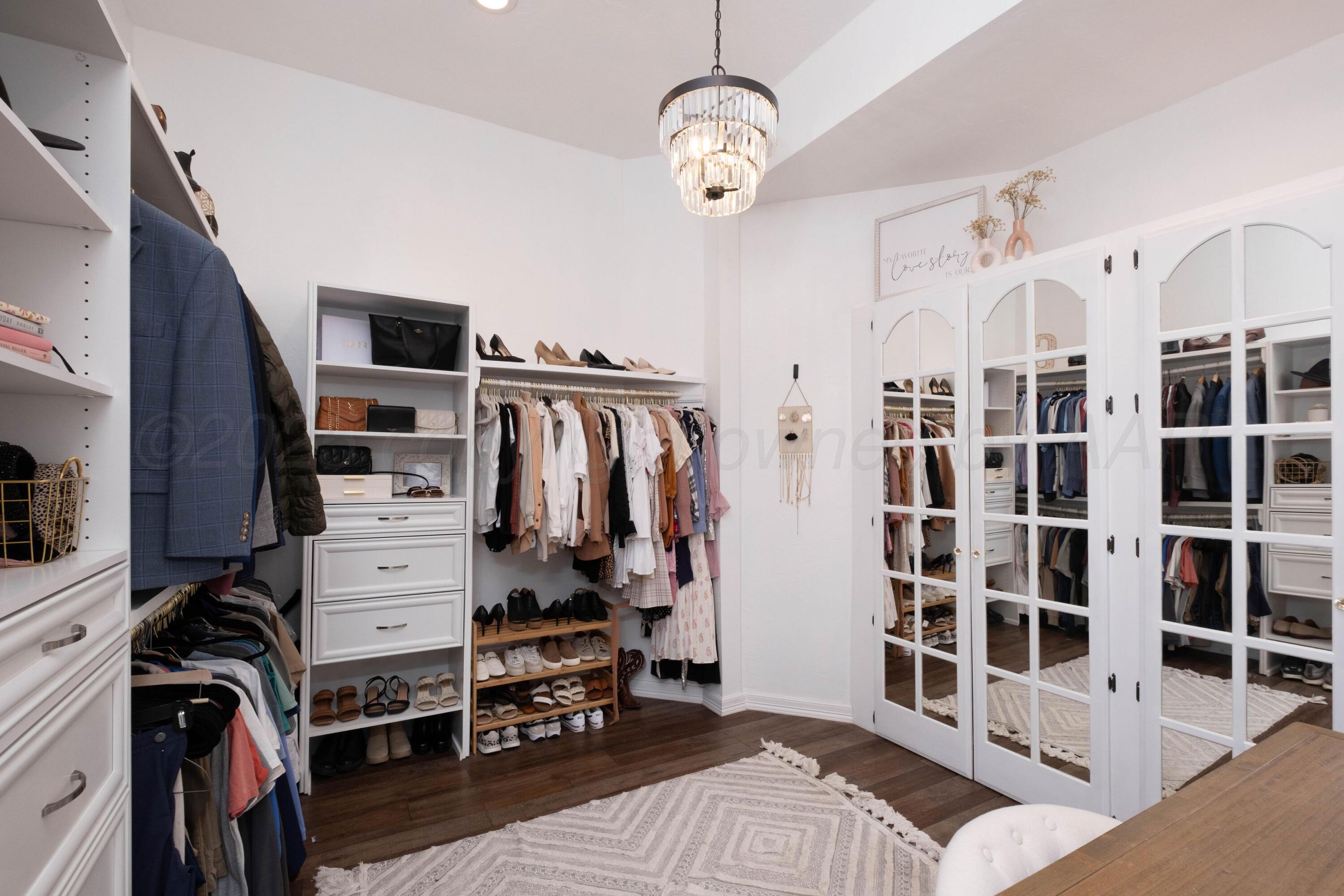 3207 Parker Street Amarillo, TX 79109 - Photo 37 of 73 a view of walk in closet with clothes and shoes